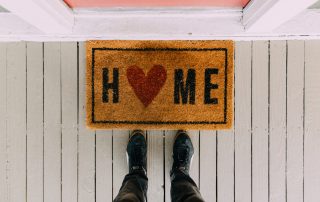 welcome home mat by front door