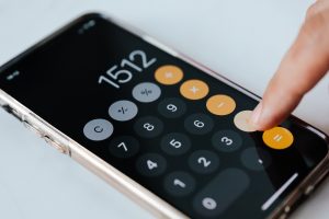 someone using an iphone calculator