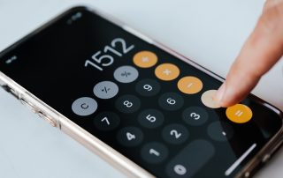 someone using an iphone calculator